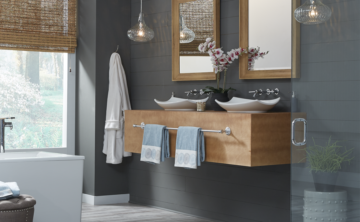 bathroom with waterproof frey wood loof flooring and walk in shower with floating vanity and sinks