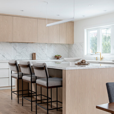 Kitchen with marble countertops and wood cabinets.